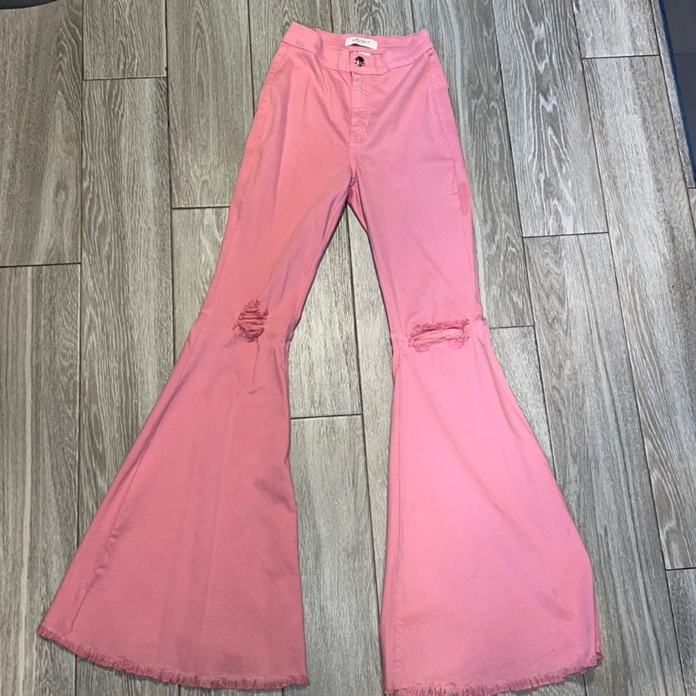 Bubblegum pink distressed flare jeans